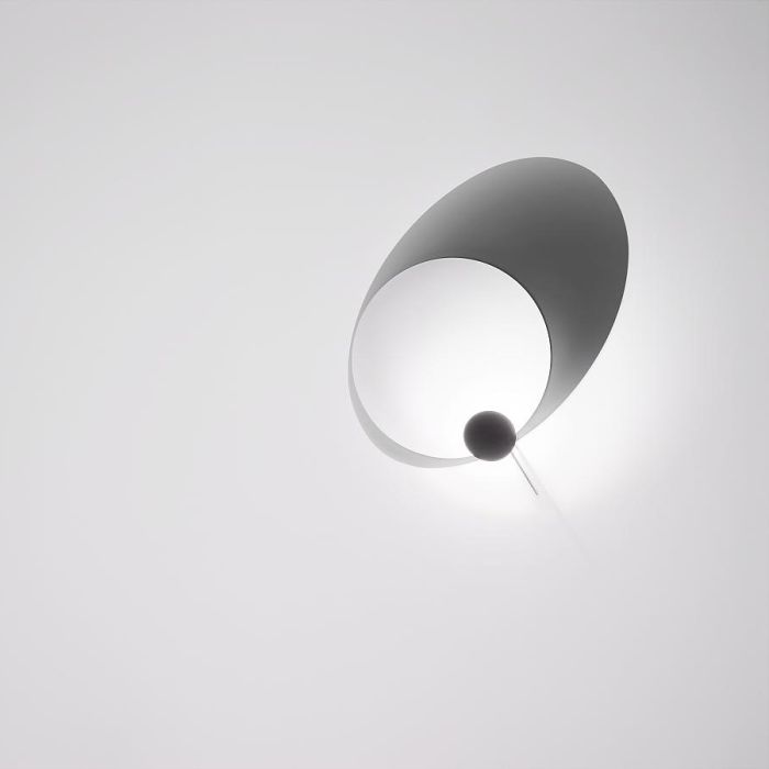 Eclipse Ellipse LED Wandleuchte von Ingo Maurer mit zwei weißen, verstellbaren Scheiben, die ein faszinierendes Licht-Schatten-Spiel erzeugen, inspiriert von der Mondfinsternis. Eclipse Ellipse LED Wandleuchte von Ingo Maurer mit zwei weißen, verstellbaren Scheiben, die ein faszinierendes Licht-Schatten-Spiel erzeugen, inspiriert von der Mondfinsternis.